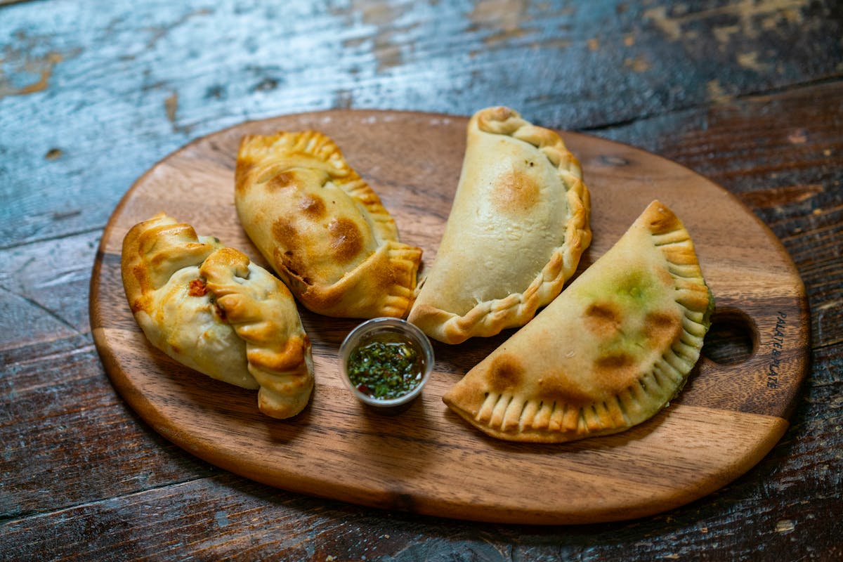 Close-up of delicious empanadas on a wooden board
