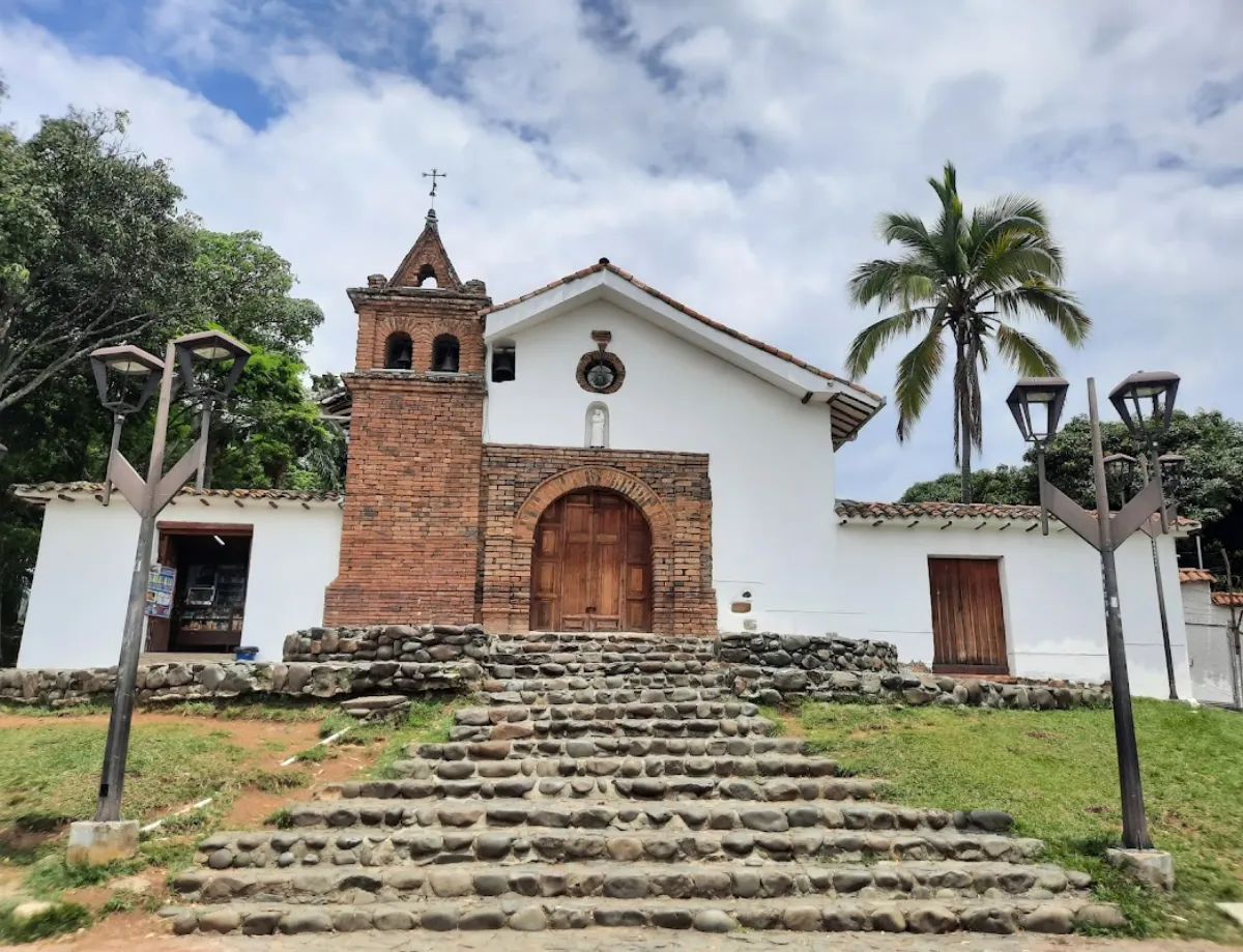 Historic Iglesia de San Antonio church in Cali with stone steps leading up to the colonial white facade