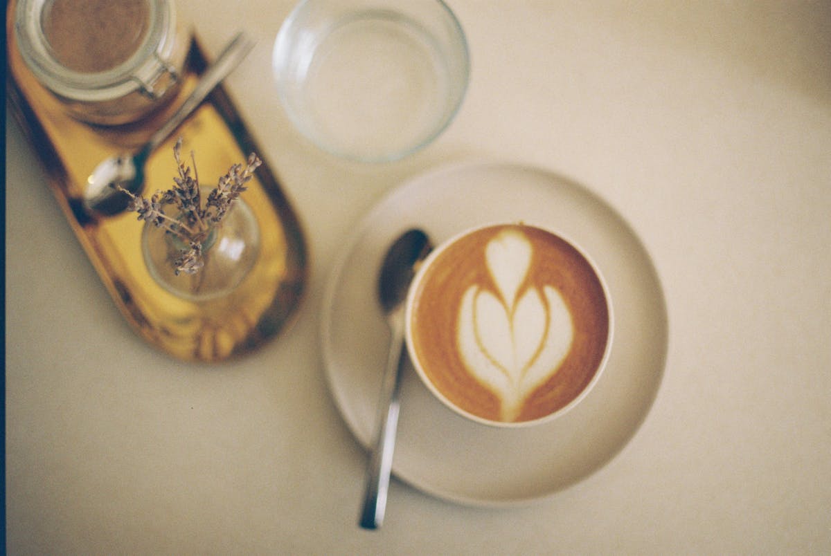 Aesthetic latte art in a cozy cafe setting