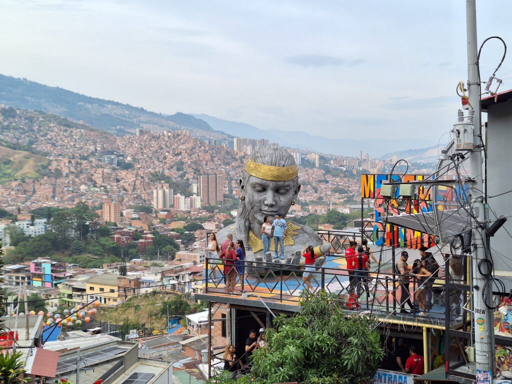 Colorful graffiti art and outdoor viewpoint in Comuna 13, Medellín with panoramic city views